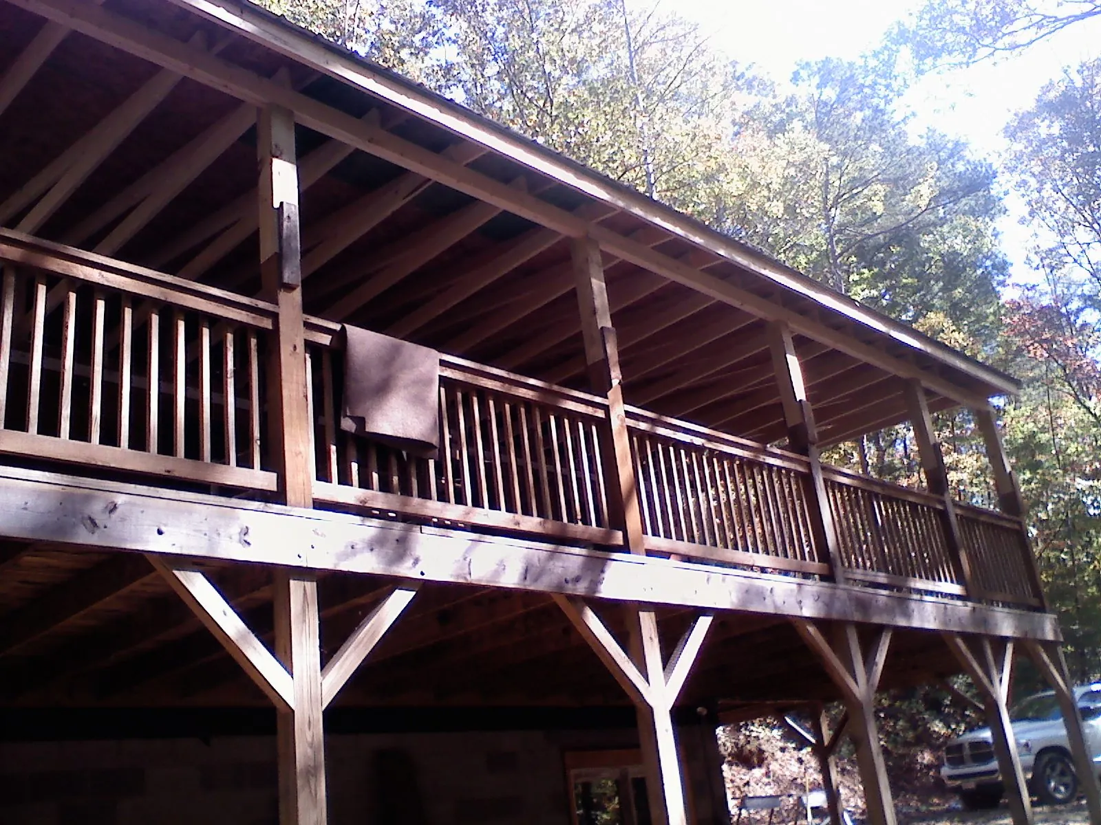 Timber framing under a new elevated porch and deck in Barnesville